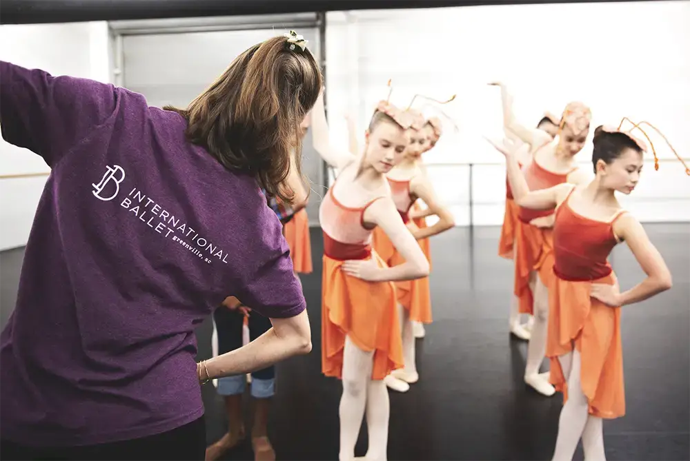 Instructor leading performers while rehearsing for Aunts n' Uncles ballet adaptation