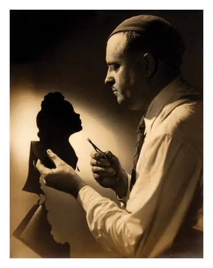 sepia photograph of carew rice cutting a woman's silhouette in aaper